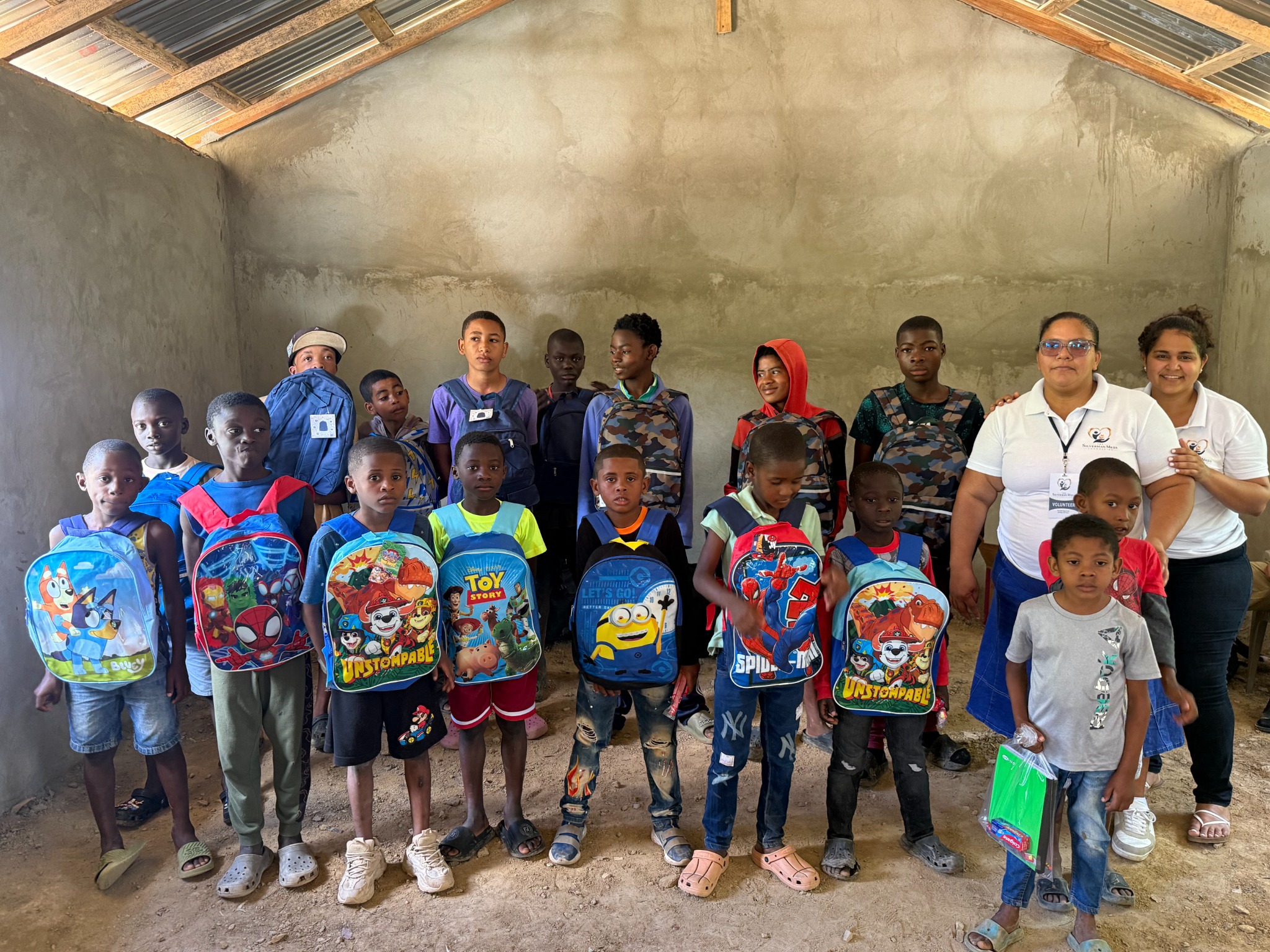 Children and volunteers gathered for a foundation distribution
