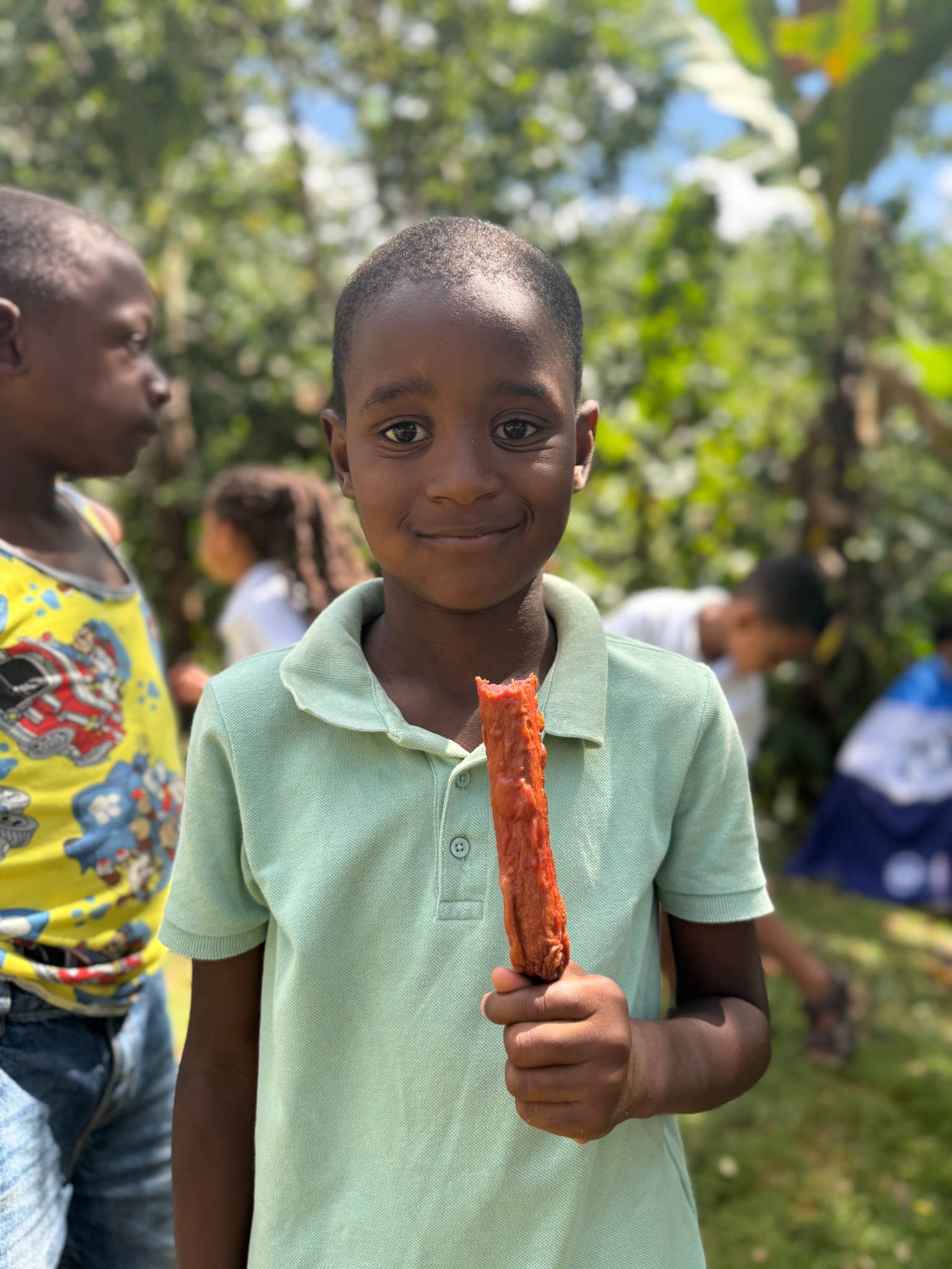 Child holding a snack at a community event