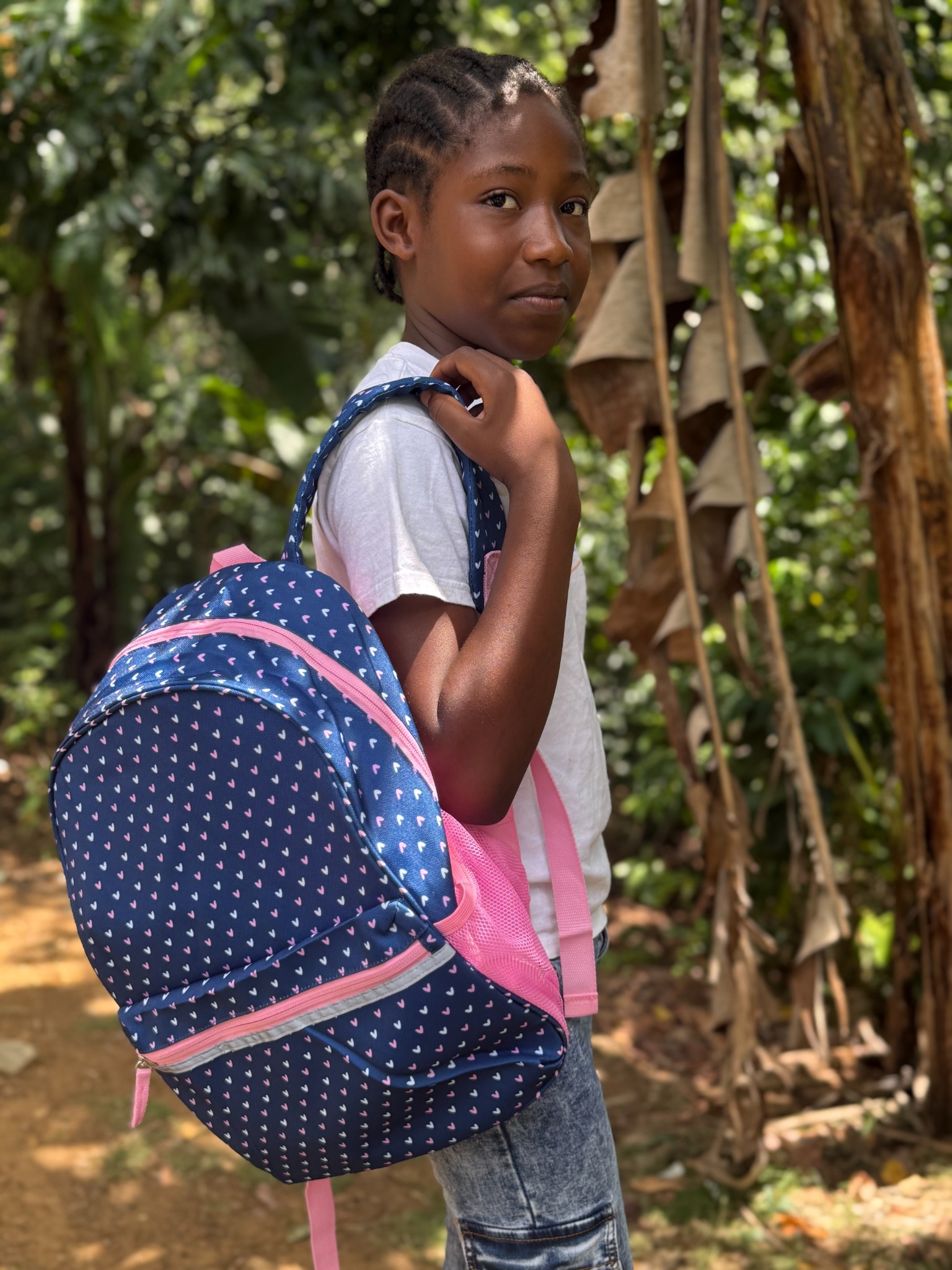 Girl carrying a backpack outdoors