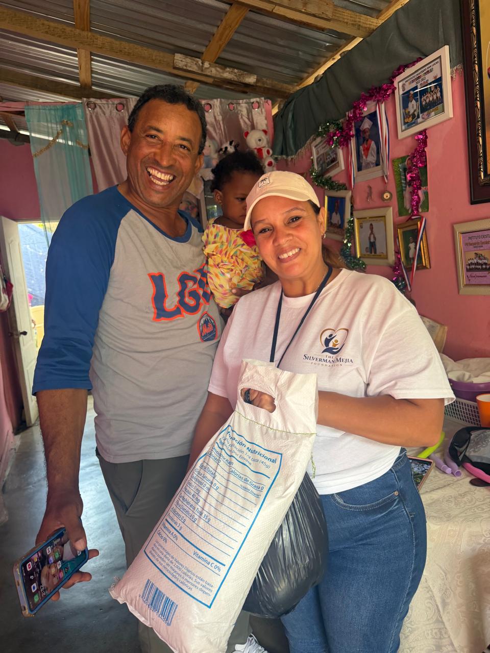 Community members with a food package